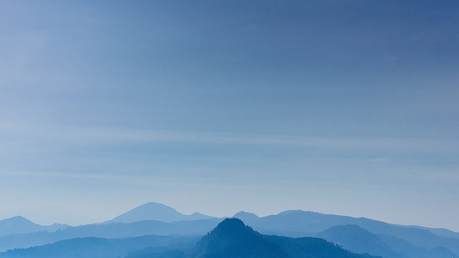 Layered blue ridges of the Appalachian mountains at dusk