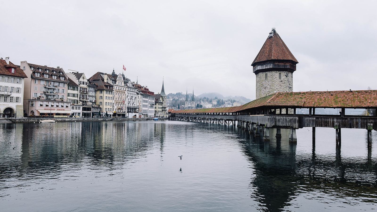 The Chapel Bridge and old town of Lucerne across the lake